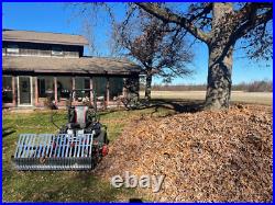 Swinging Tool Bar and Rake with tall Leaf Pushers mounts on a zero turn mower