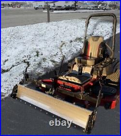 Swinging Tool Bar and Snow Blade Ezra Lawn Care Equipment mounts on a zero turn